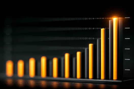 Orangefarbene Balken eines steigenden Balkendiagramms vor dunklem Hintergrund.